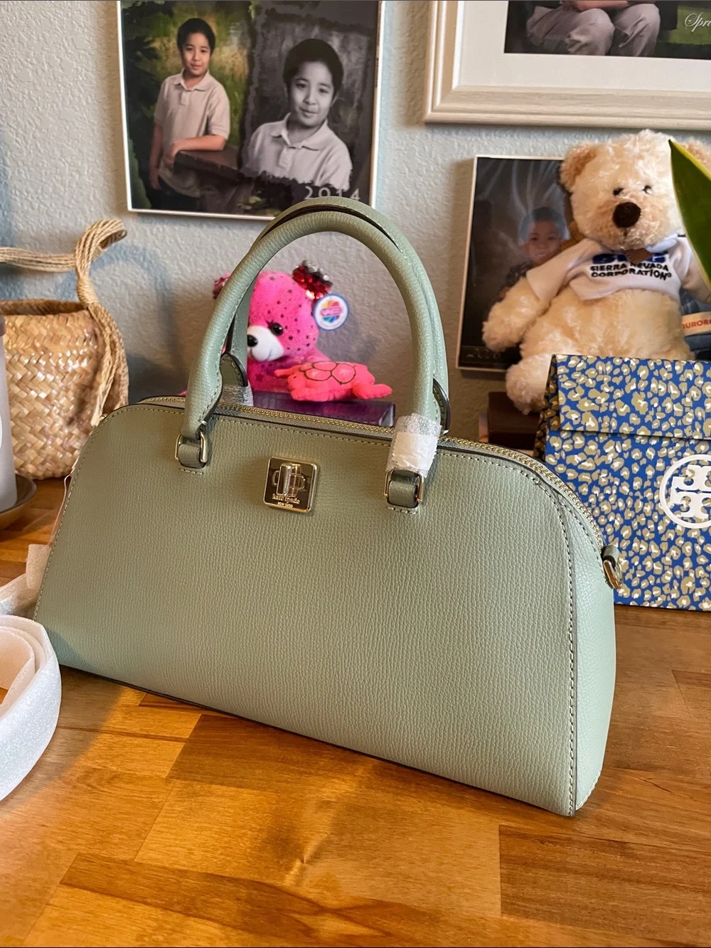 The Kate Spade KK114 refers specifically to the Phoebe East West Satchel